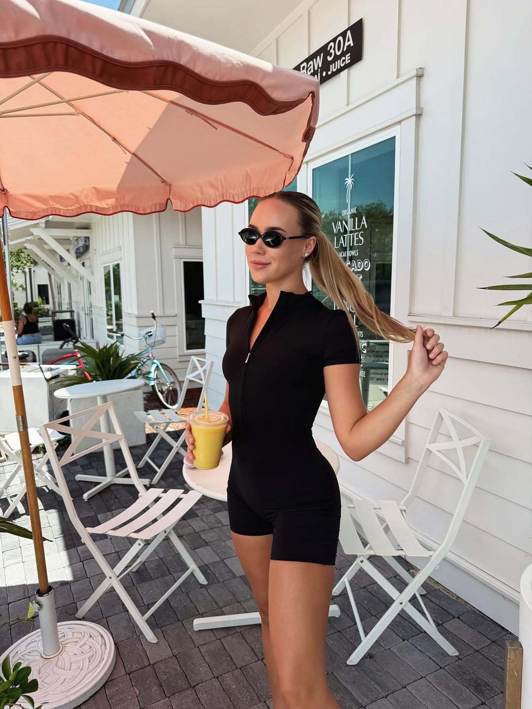 Nova Short-Sleeve Zip Romper in Black