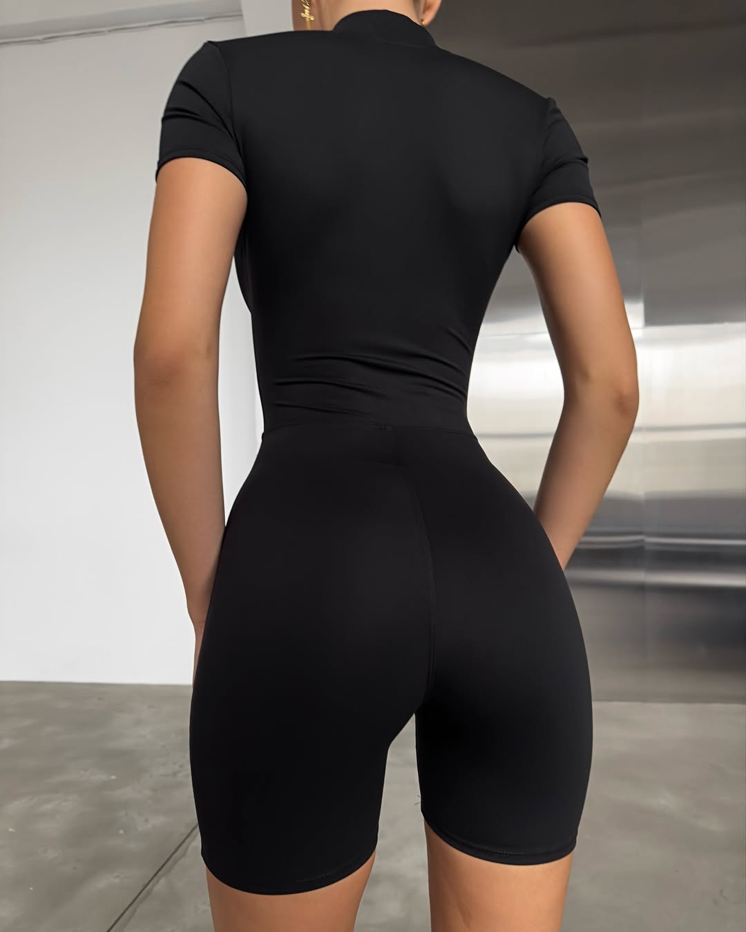 Nova Short-Sleeve Zip Romper in Black