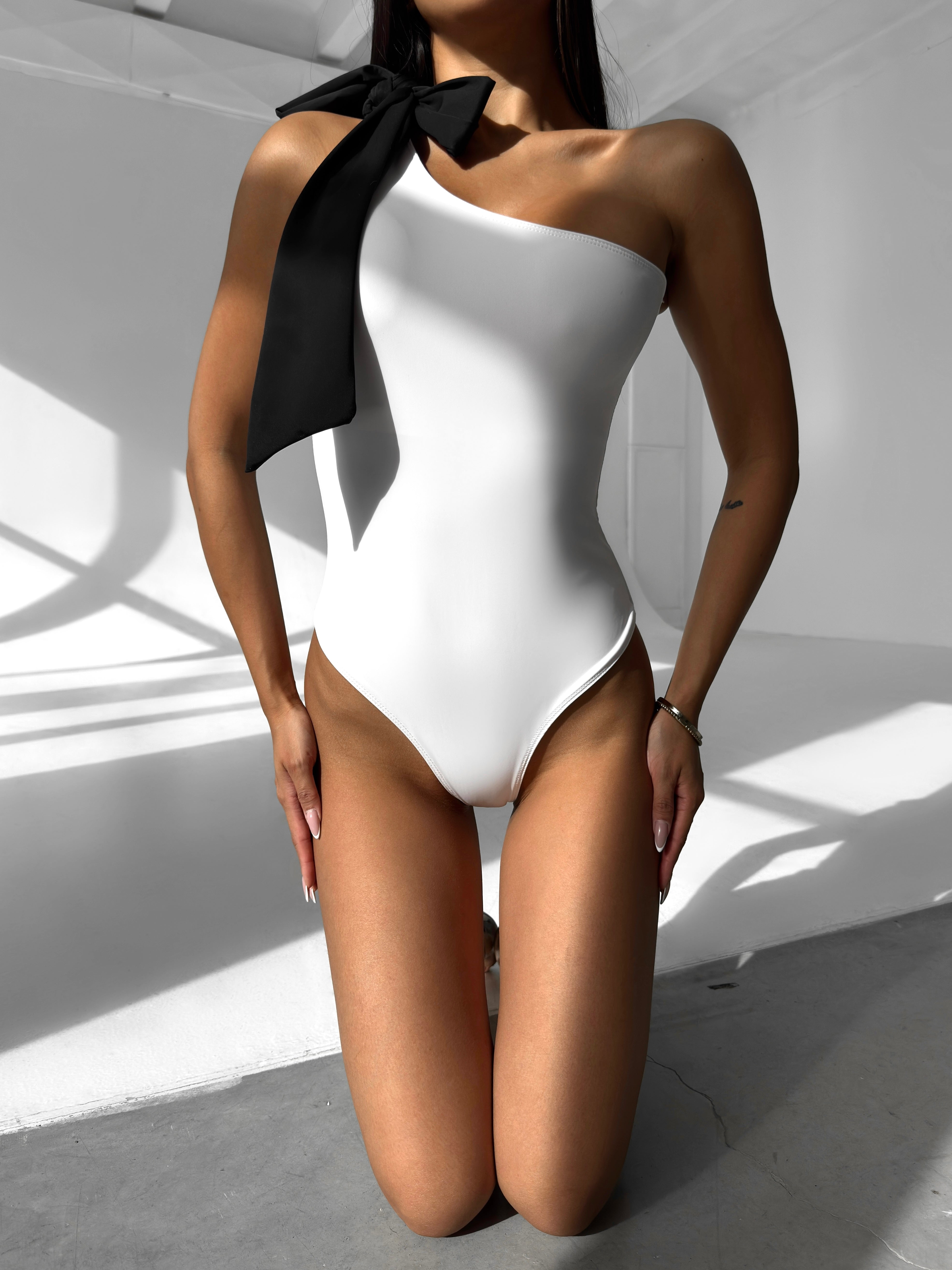 Muse Bow Asymmetric One Piece in White