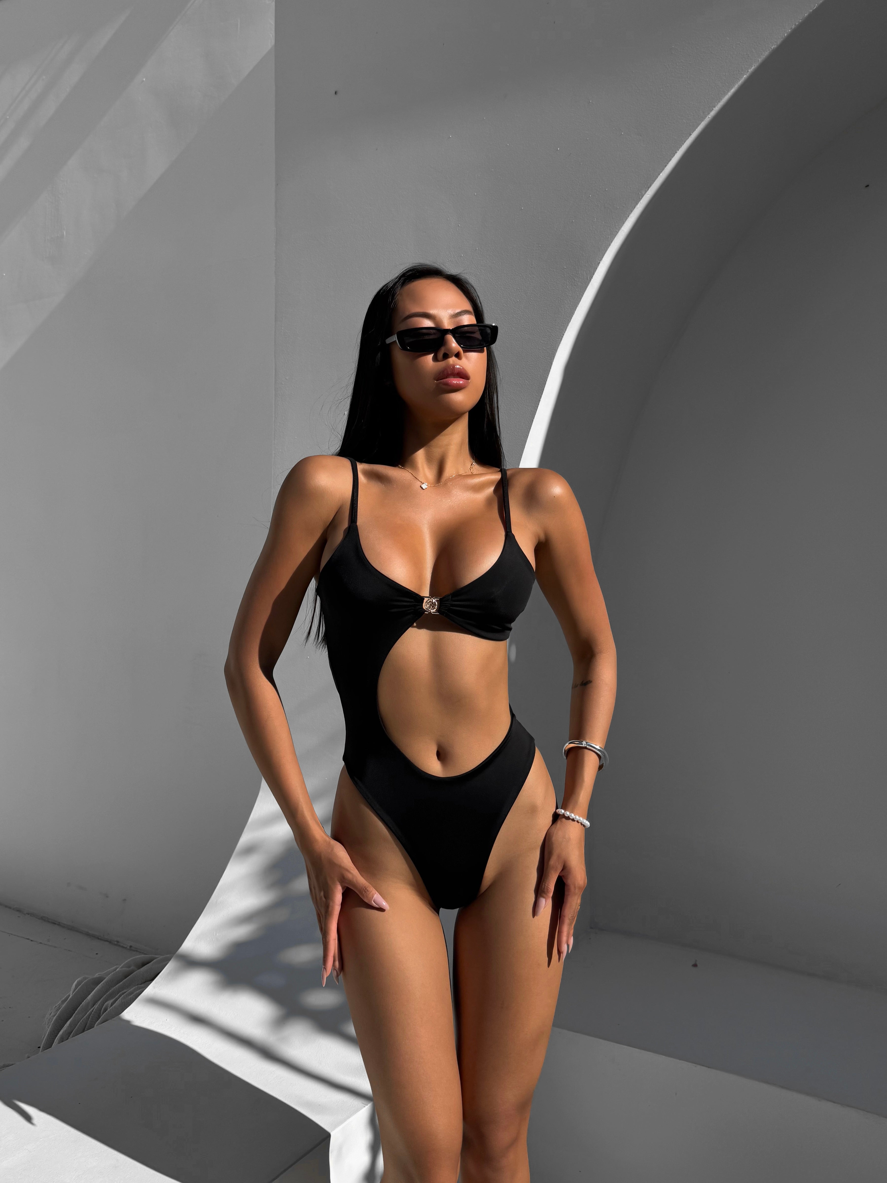 Coral Asymmetric Cut Out Waist One Piece in Black