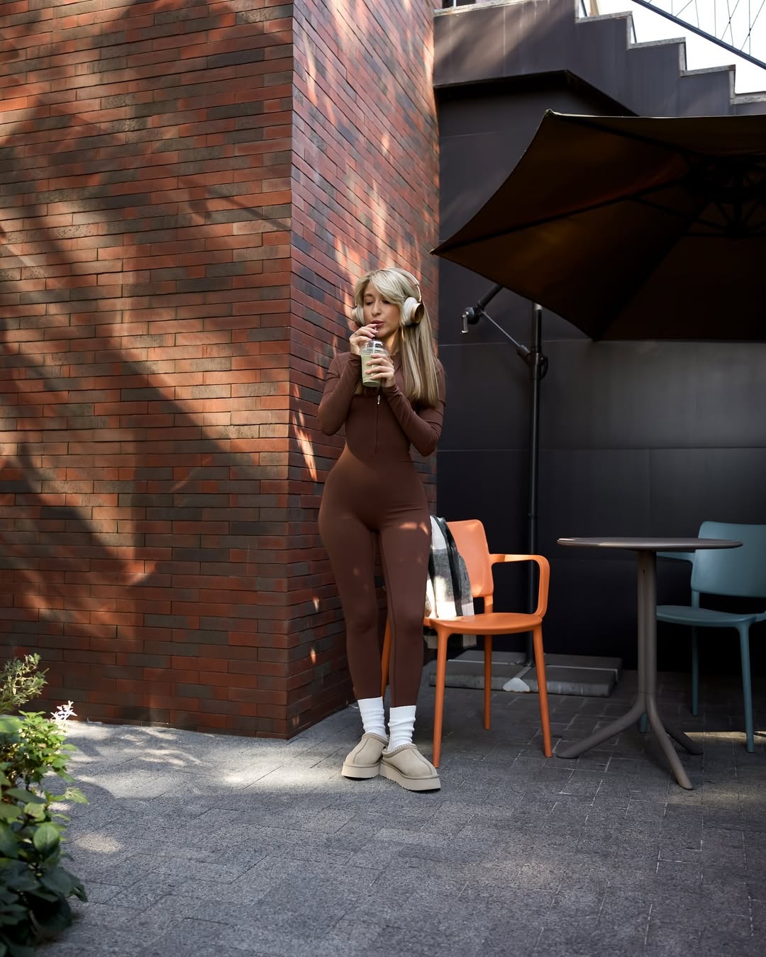 Nova Zip-Front Long-Sleeve Jumpsuit in Brown