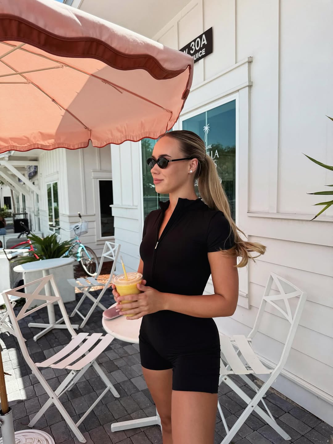 Nova Short-Sleeve Zip Romper in Black