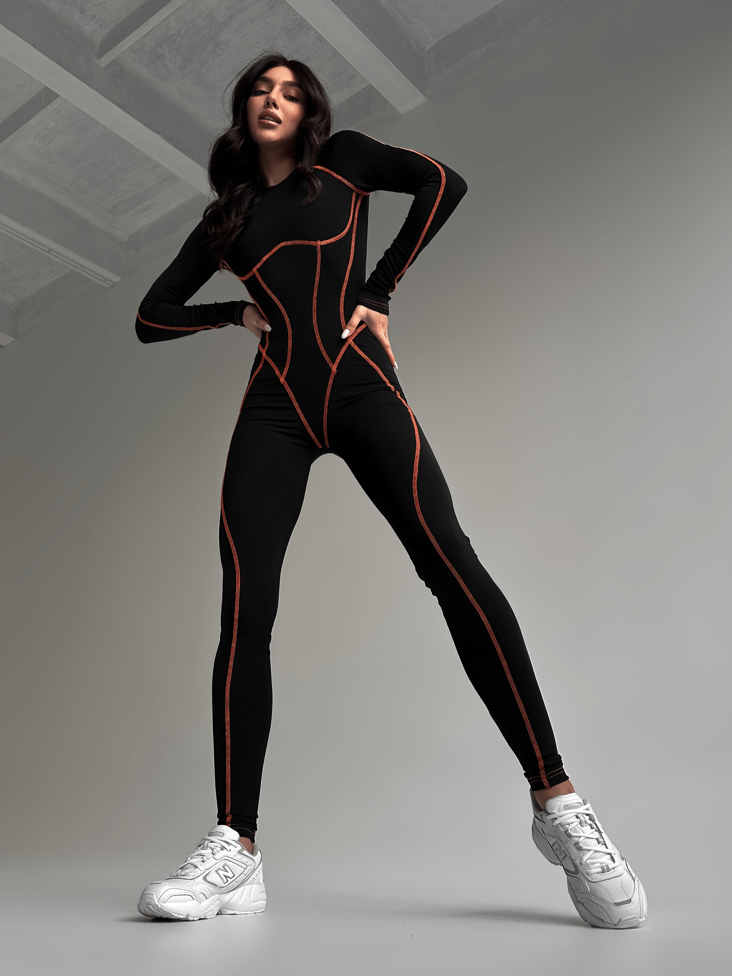 Galaxy Contour Seam Open Back Long Sleeve Jumpsuit in Black and Neon Orange