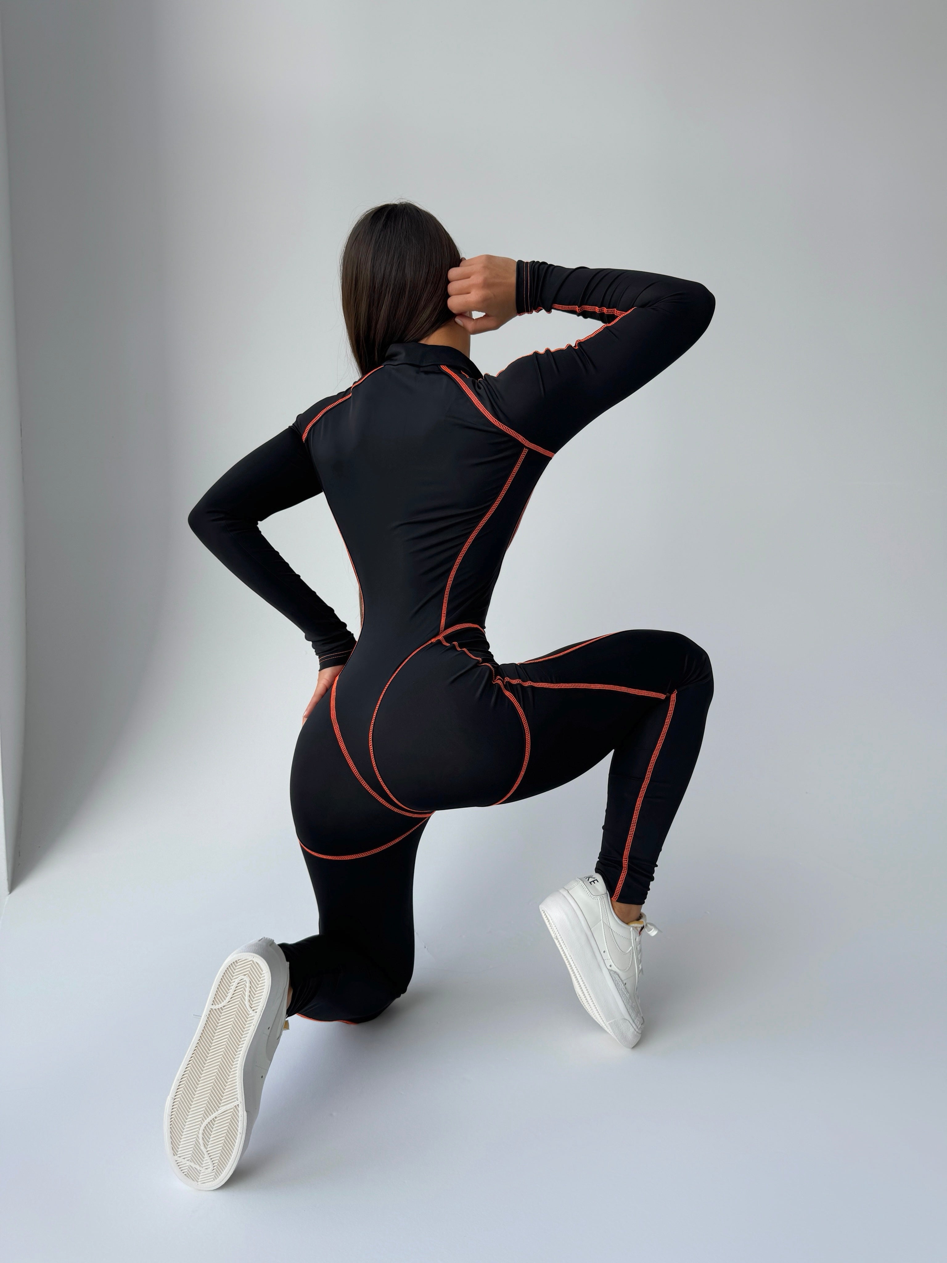 Galaxy Zip Contrast Contour Seam Long Sleeve Jumpsuit in Black and Neon Orange