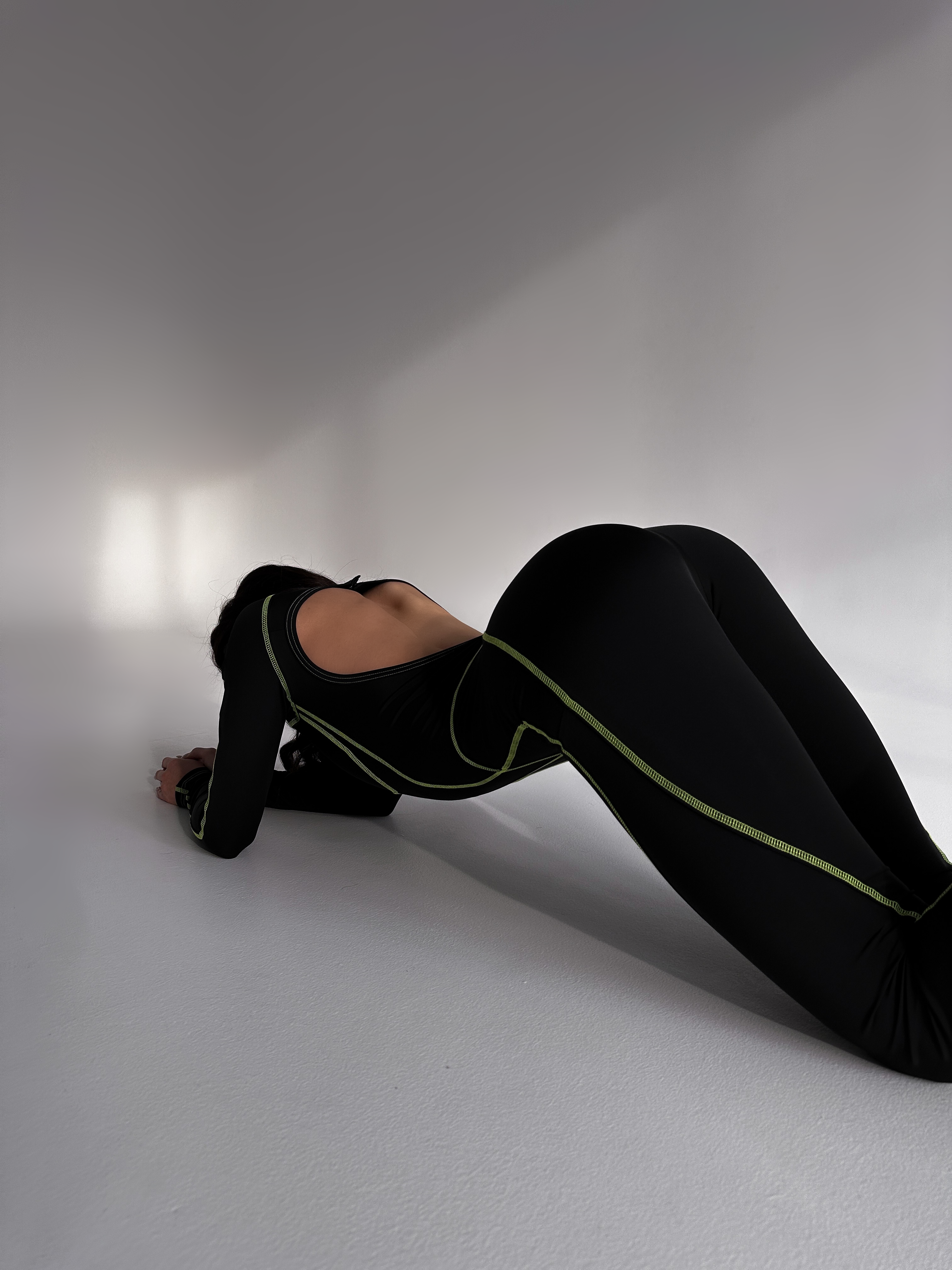 Galaxy Contour Seam Open Back Long Sleeve Jumpsuit in Black and Neon Green