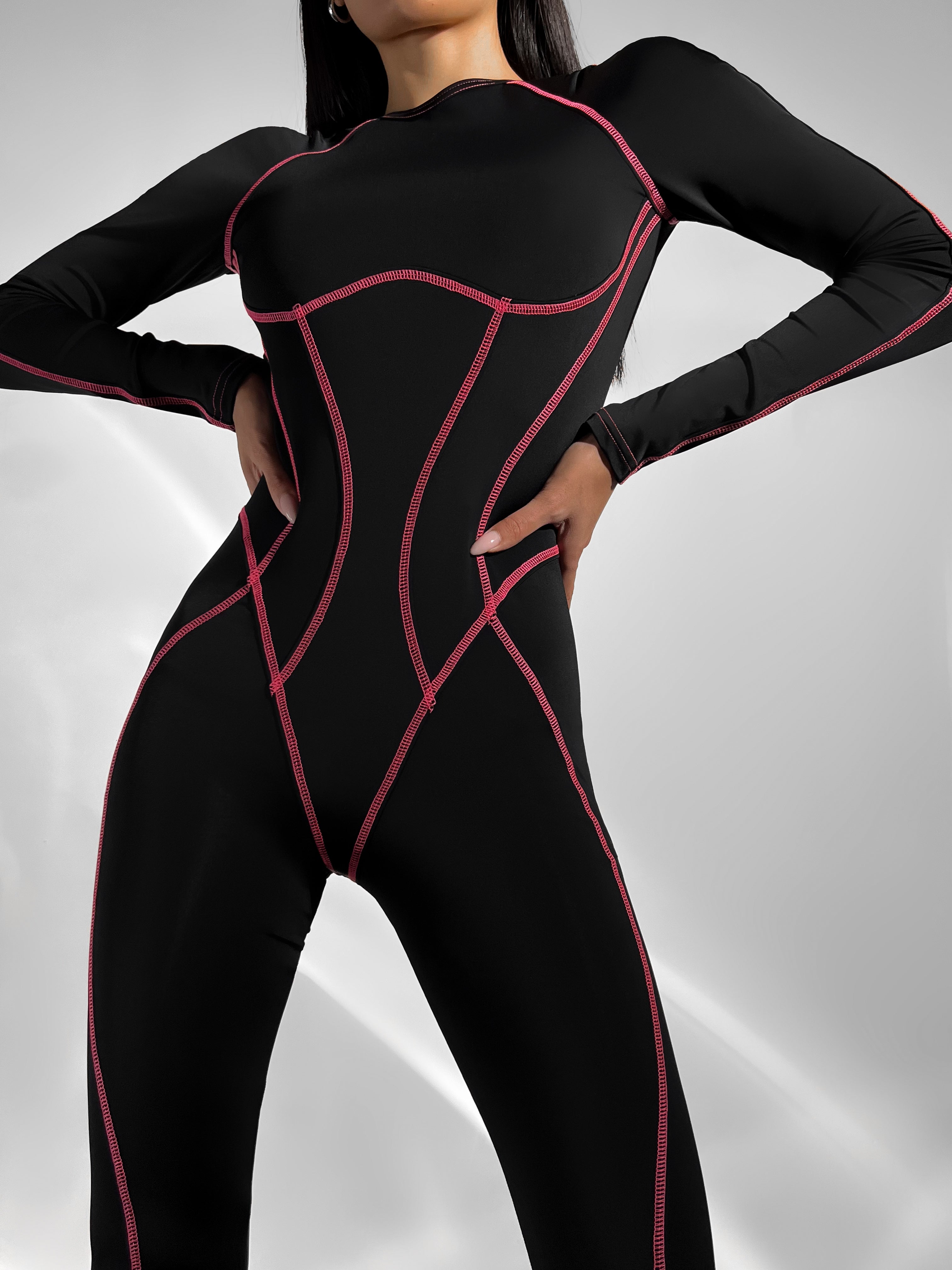 Galaxy Contour Seam Open Back Long Sleeve Jumpsuit in Black and Neon Pink