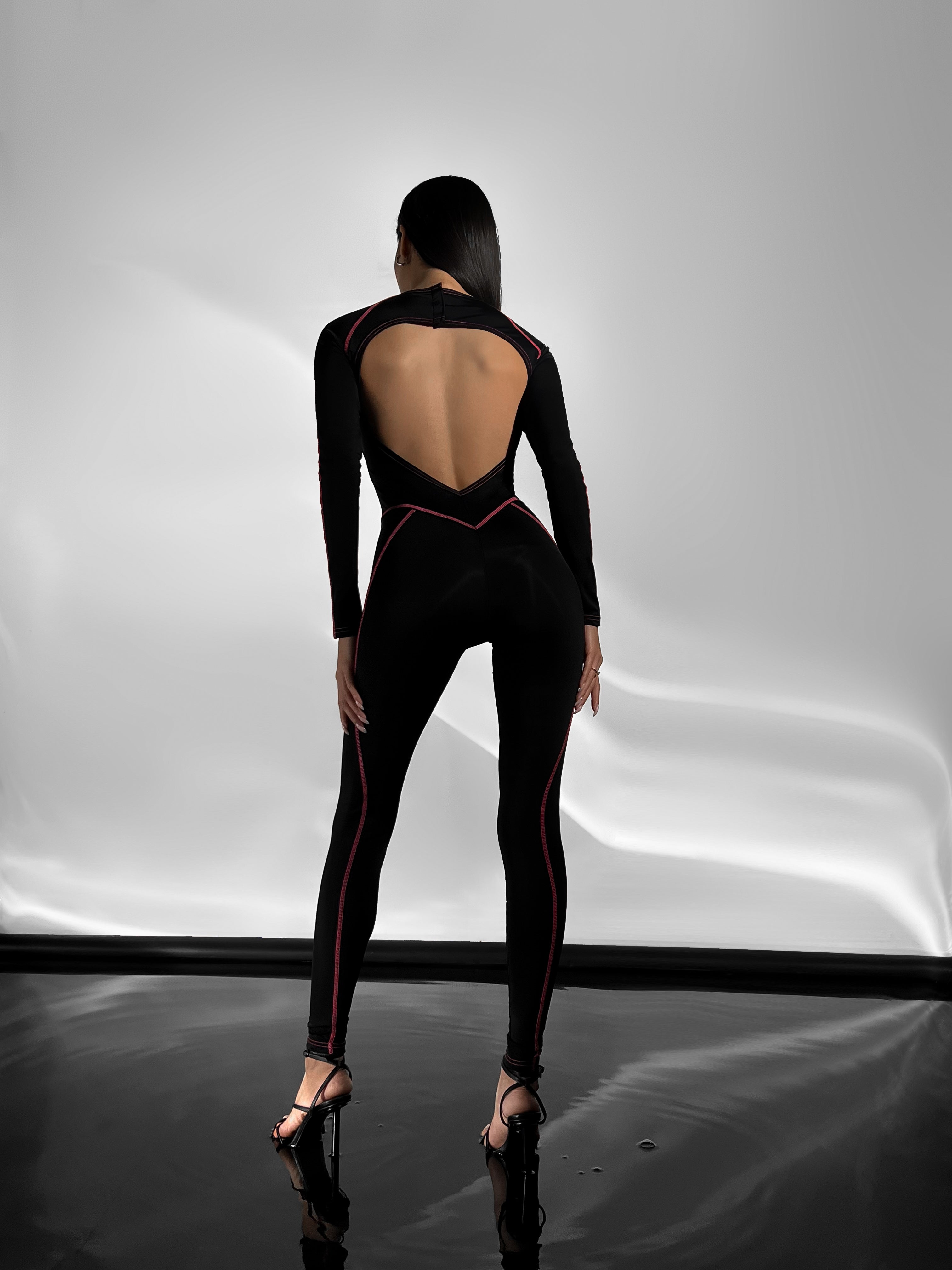 Galaxy Contour Seam Open Back Long Sleeve Jumpsuit in Black and Neon Pink