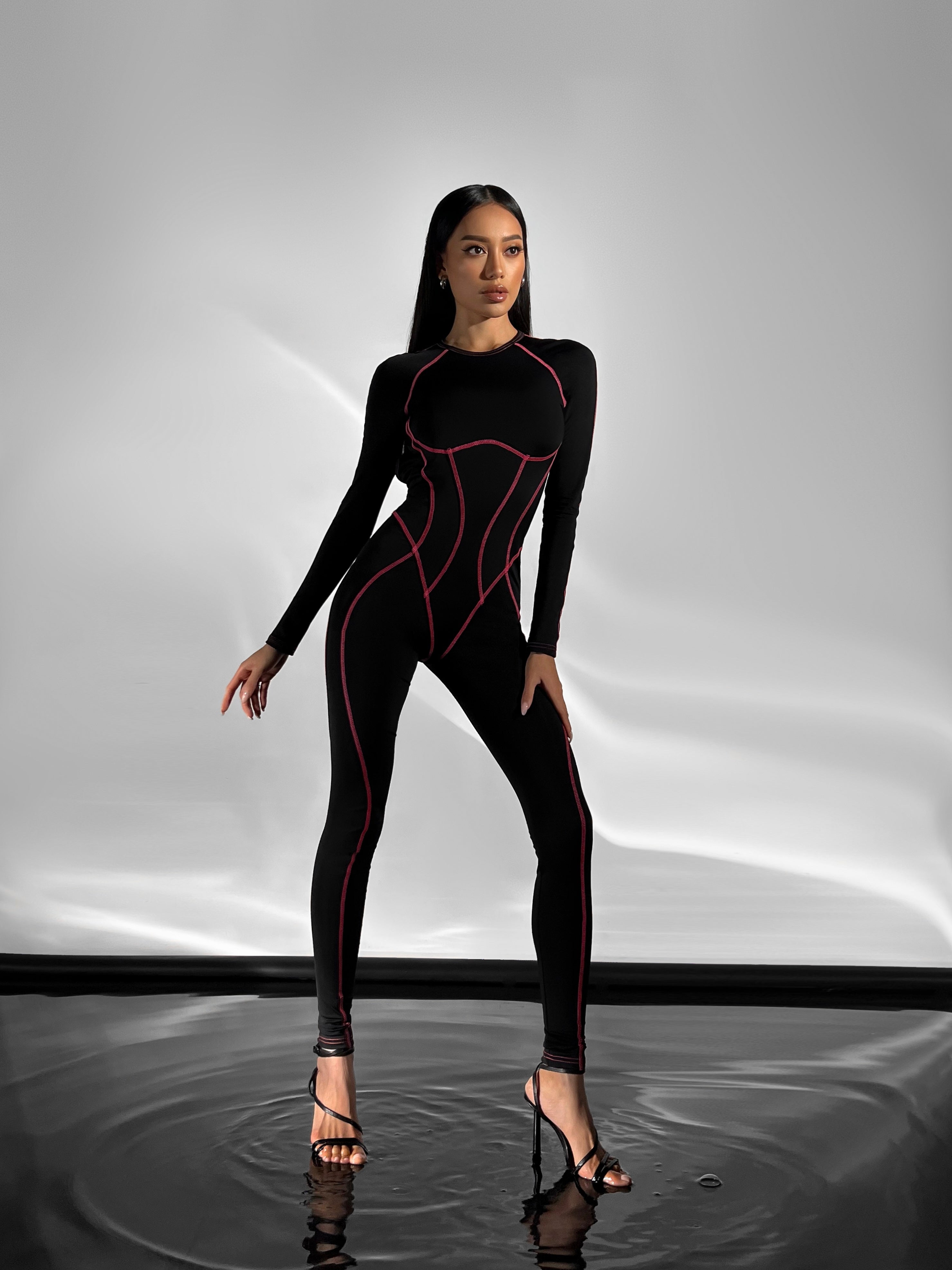 Galaxy Contour Seam Open Back Long Sleeve Jumpsuit in Black and Neon Pink