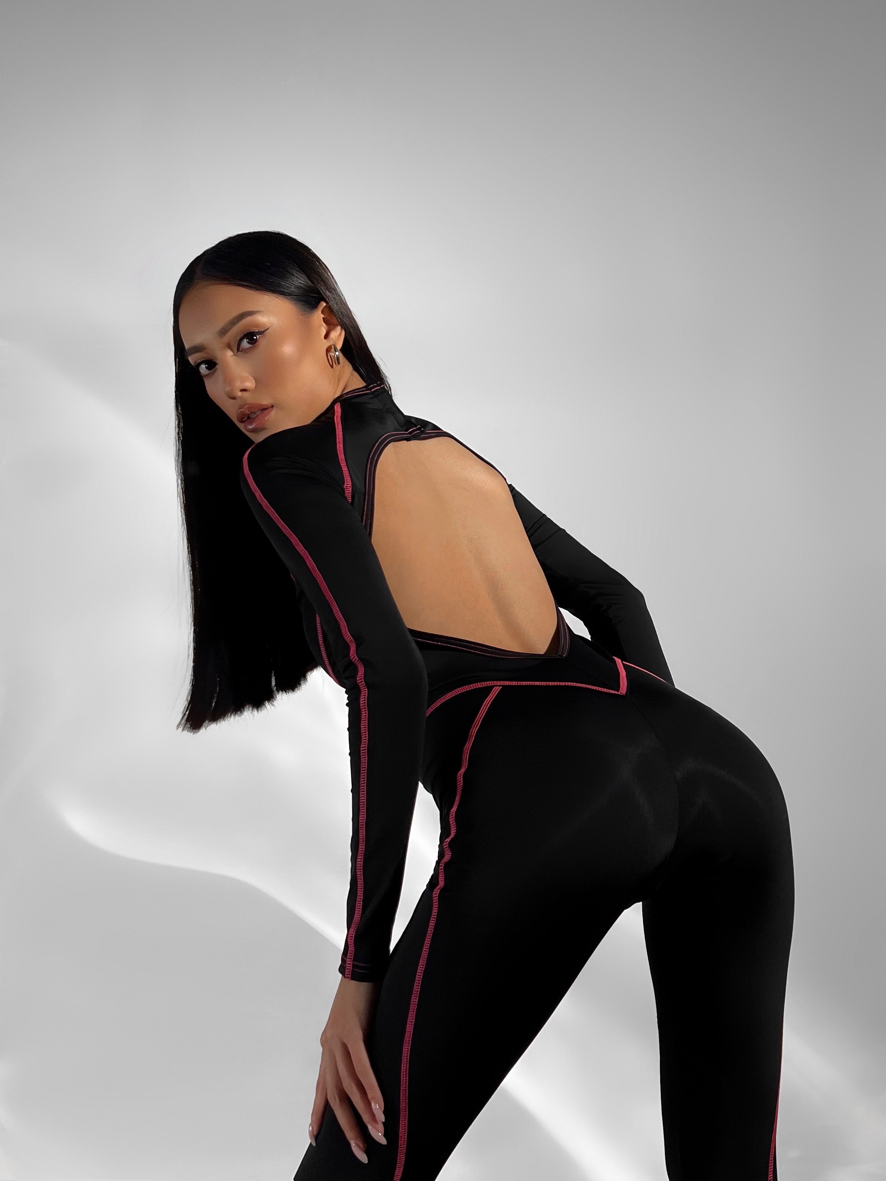 Galaxy Contour Seam Open Back Long Sleeve Jumpsuit in Black and Neon Pink