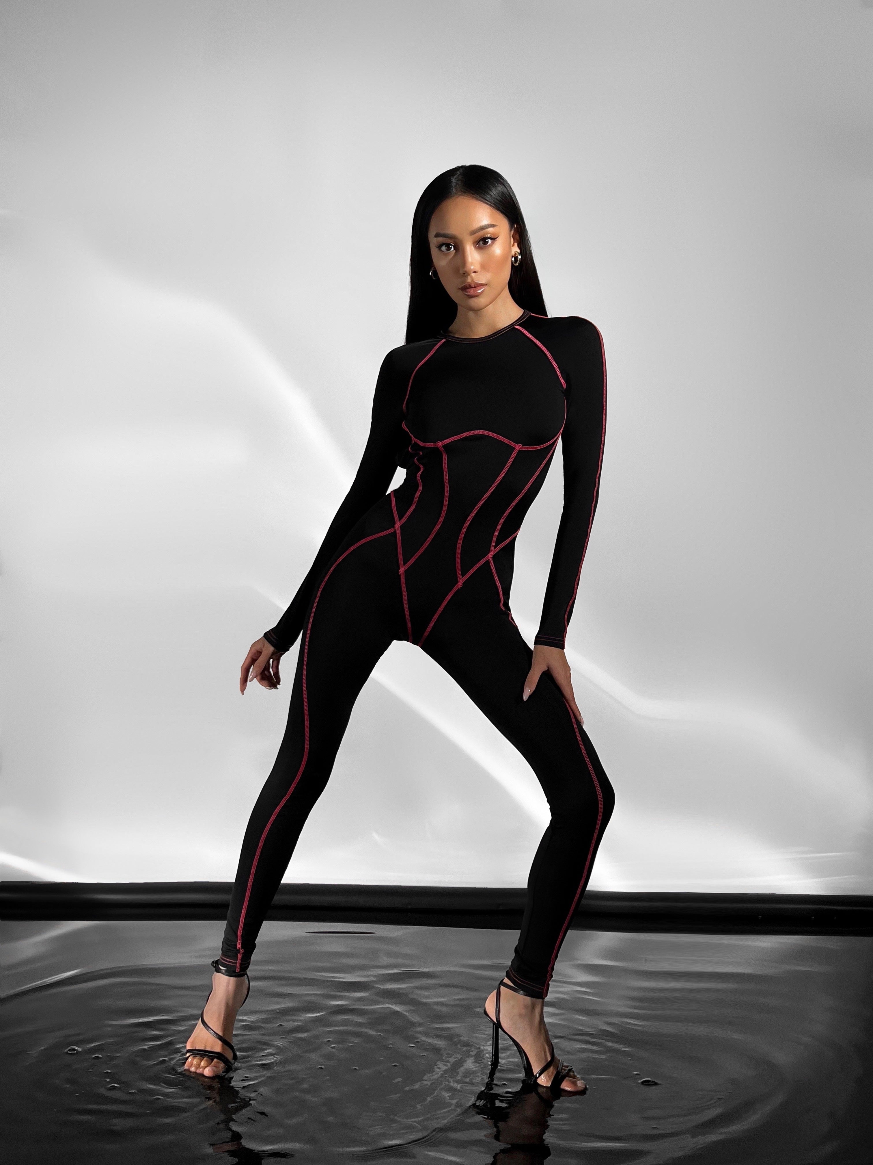 Galaxy Contour Seam Open Back Long Sleeve Jumpsuit in Black and Neon Pink